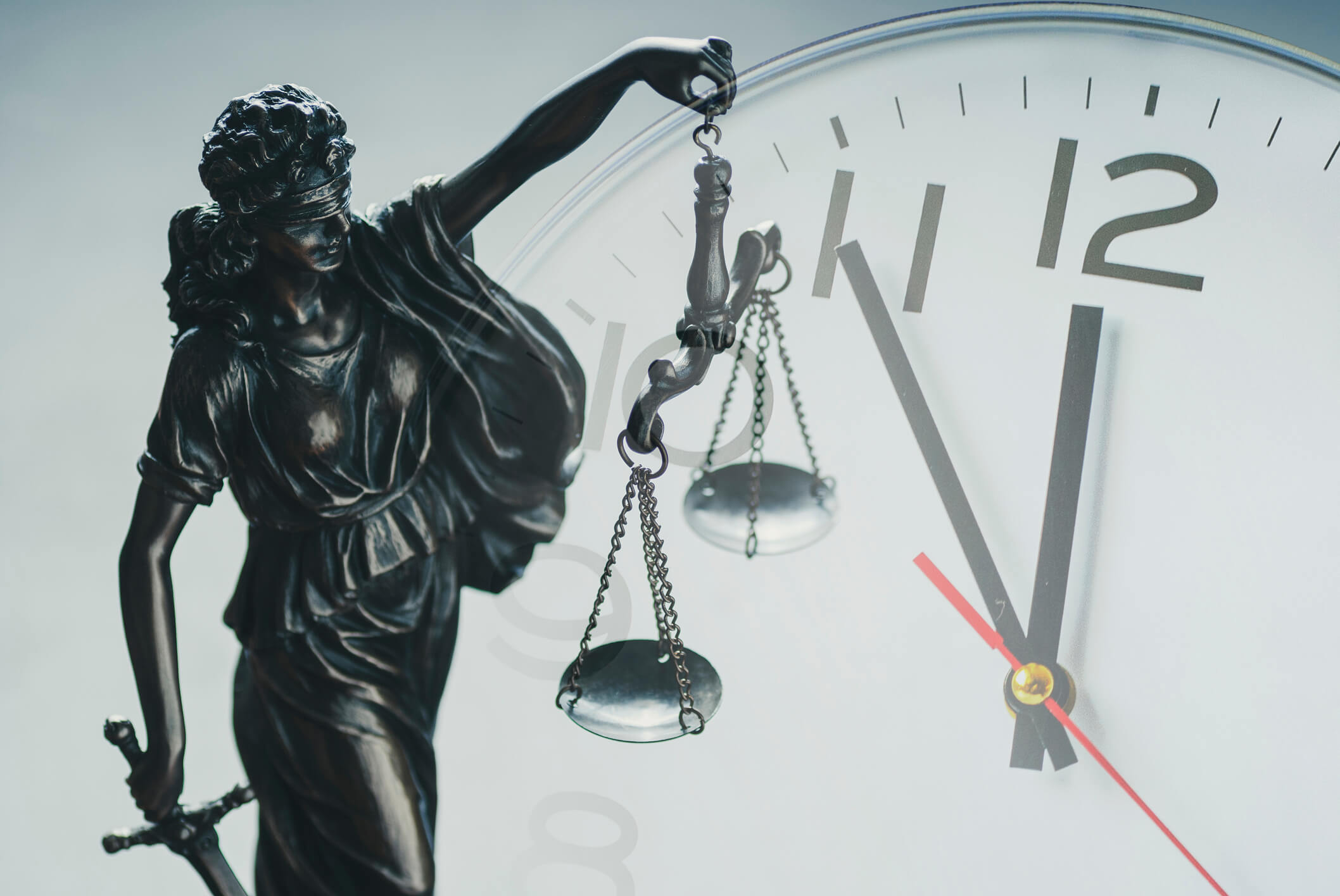 lady justice and clock representing time-barred debt
